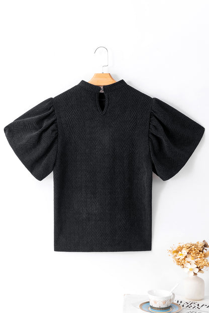 Blusa con cuello redondo y manga abullonada